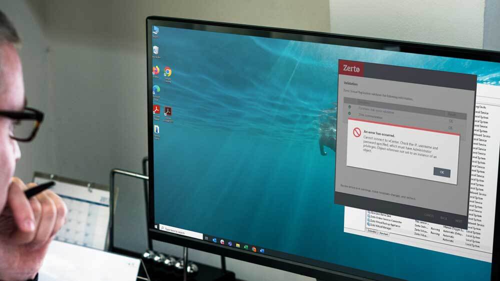 man wearing glasses stares at computer screen showing recovery failure during a stress test